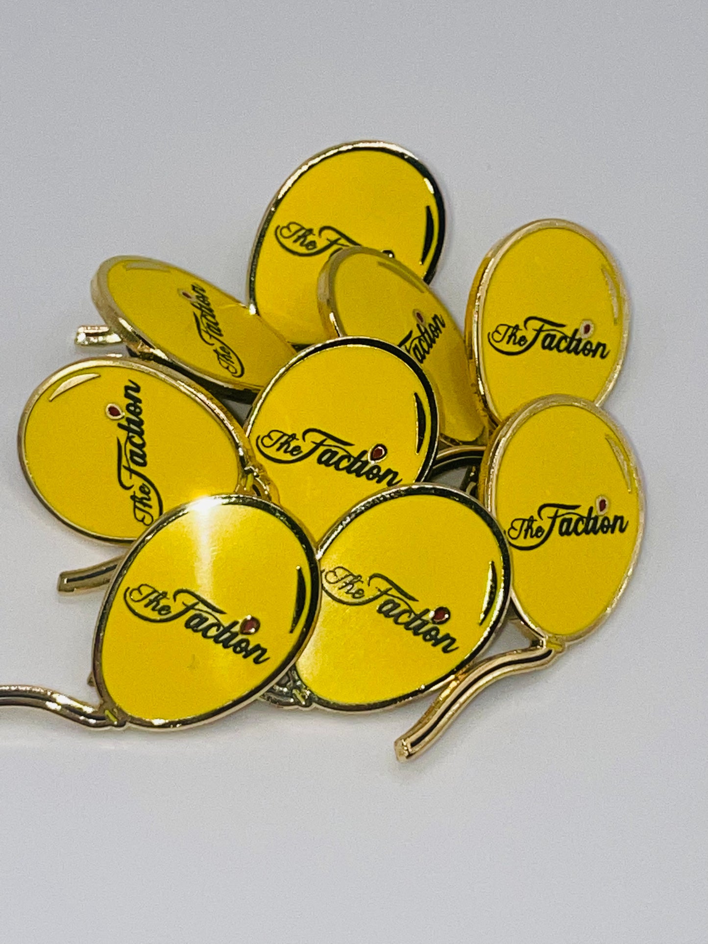 The Faction Yellow Balloon Lapel Pin