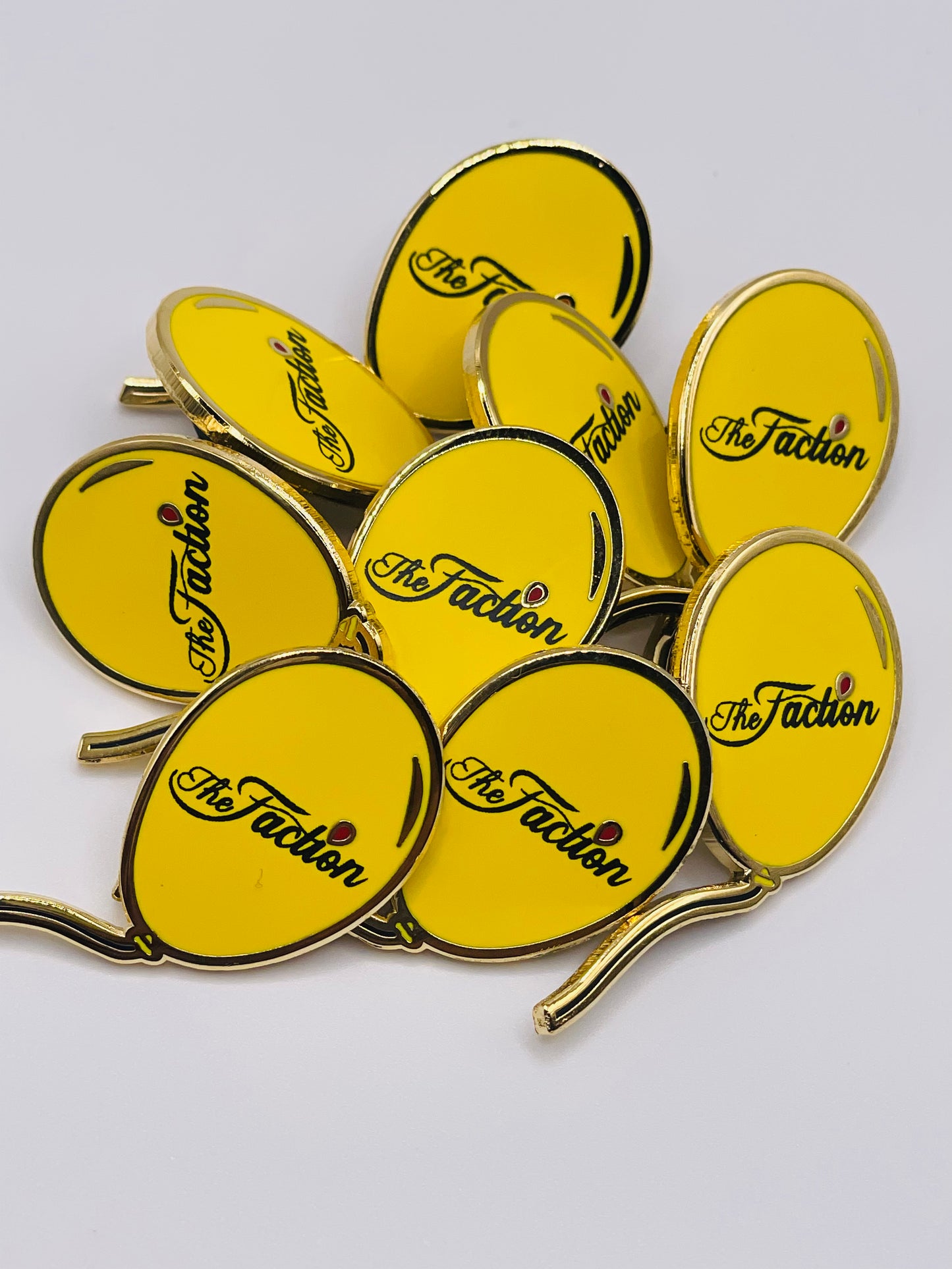 The Faction Yellow Balloon Lapel Pin